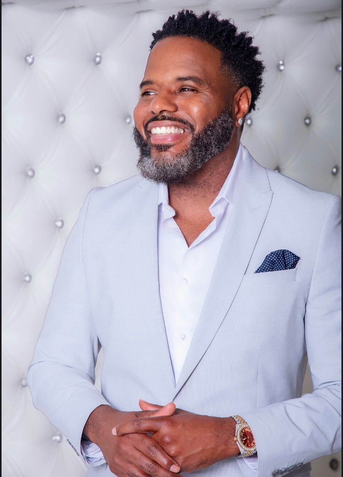 Marlon Whitfield laughing, looking off to the side
